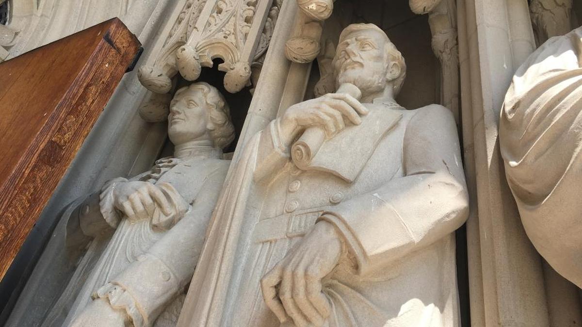 A statue of Confederate Gen. Robert E. Lee (center) was among the statues that adorn the entrance to Duke Chapel, until vandals defaced it and the university removed it.