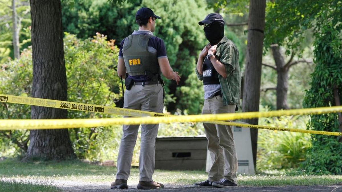 Law enforcement agents investigate the scene in Alexandria, Va., Thursday, June 15, 2017, the day after House Majority Whip Steve Scalise of La. was shot during during a congressional baseball practice.