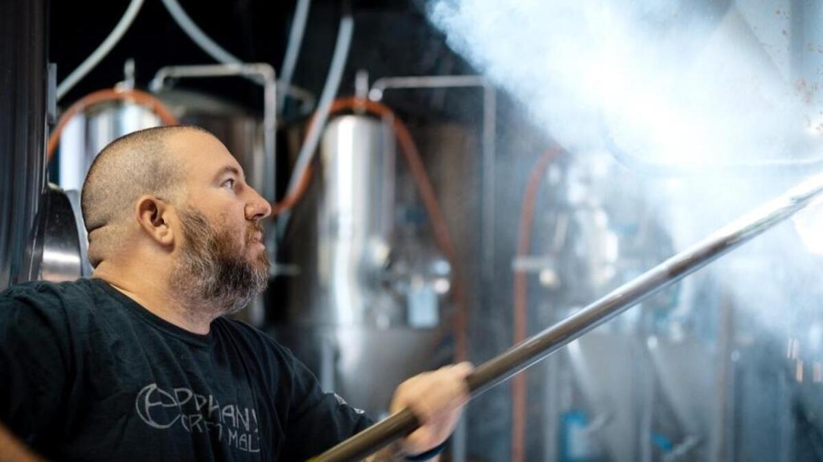 Erik Lars Meyer, of Mystery Brewing Company in Hillsborough, is one of 127 living wage employers in Orange County. “If you take care of your employees,” says Meyer, “they will take care of your business.”