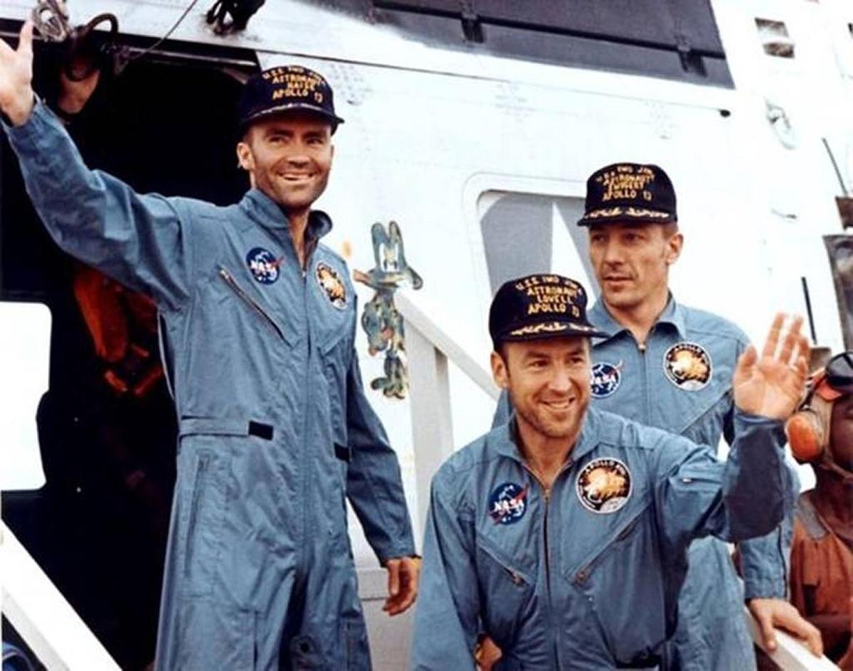 Apollo 13 astronauts, from left, Fred W Haise, Jim Lovell and John Swigert, leave a helicopter to step aboard the USS Iwo Jima on April 17, 1970, after their successful recovery in the Pacific Ocean.