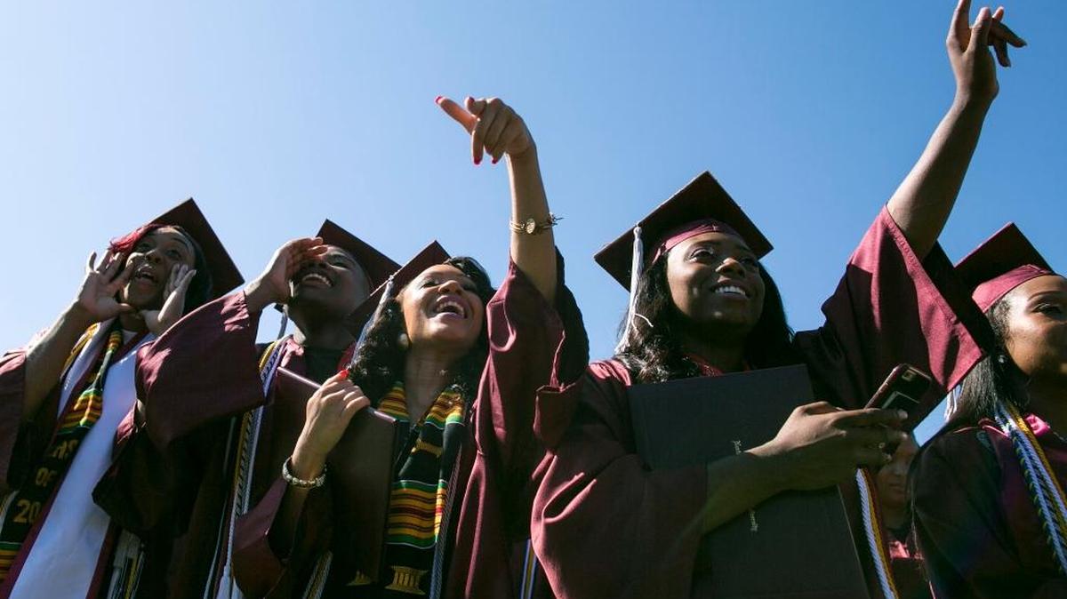 Graduates celebrate as their friends names are called during the 127th Commencement Exercises at North Carolina Central University in Durham last May. (News & Observer file photo).