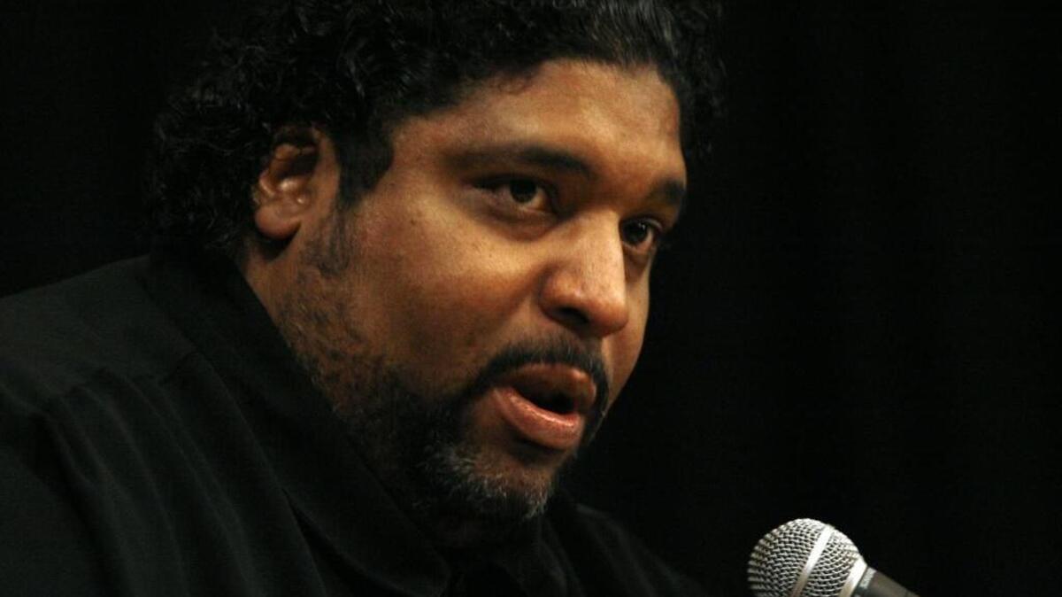 The Rev. Dr. William J. Barber, president of the NC NAACP, speaks during a workshop about faith and money at the Hayti Heritage Center in Durham.