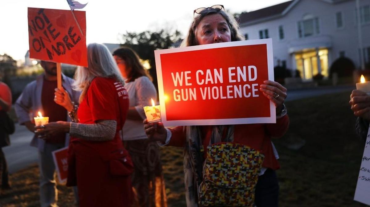 Dozens of people attend a vigil remembering the 59 people killed in Sunday's shooting in Las Vegas and calling for action against guns on October 4, 2017 in Newtown, Connecticut. The vigil, organized by the Newtown Action Alliance, was held outside the National Shooting Sport Foundation and looked to draw attention to gun violence in America. Twenty school children were killed at the Sandy Hook Elementary School shooting in Newtown on December 14, 2012.