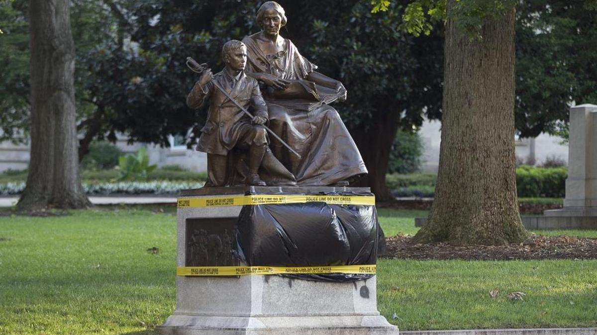 Black plastic and police tape cover the vandalism to the Confederate Women’s Monument on the State Capitol grounds on July 21, 2015 in Raleigh, NC. The vandalism was discovered overnight and was covered by daybreak.