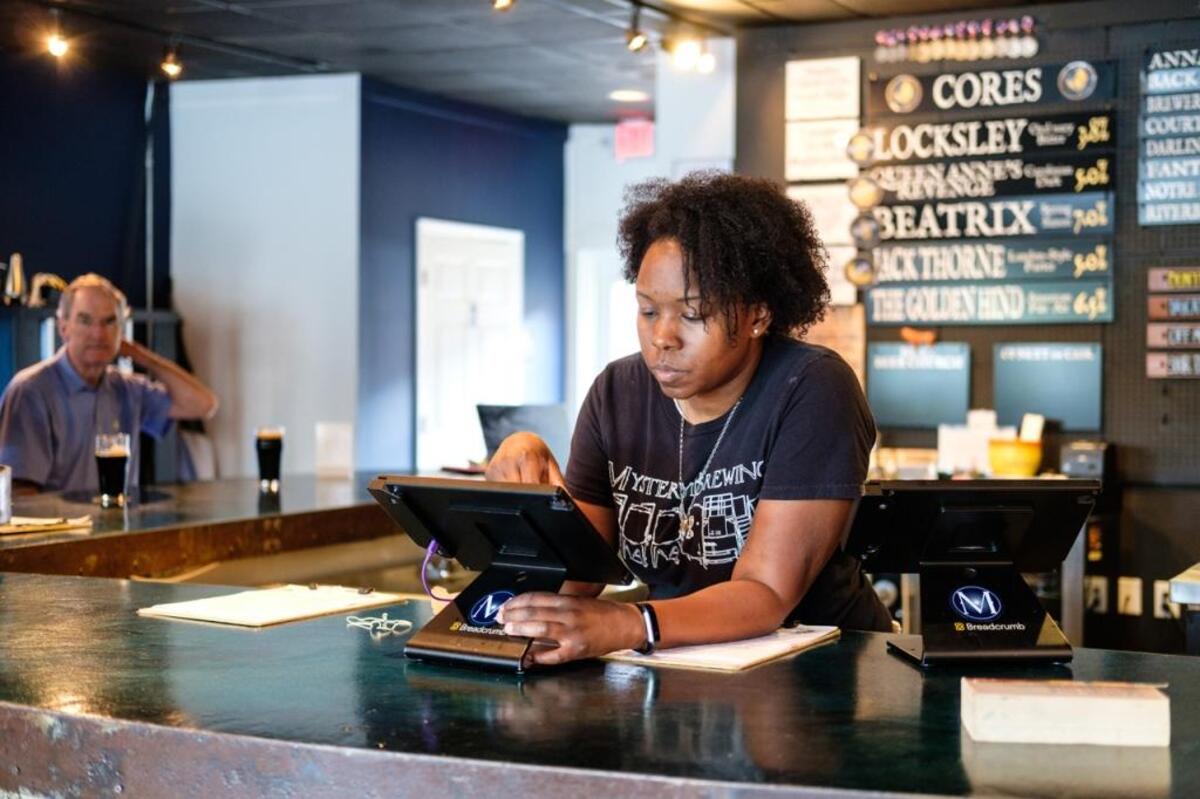 “I want to pay people enough that they will stay,” says Ari Sanders, general manager at Mystery Brewing Co. “The easiest way to keep employees is to let them know they’ve got some money coming.”