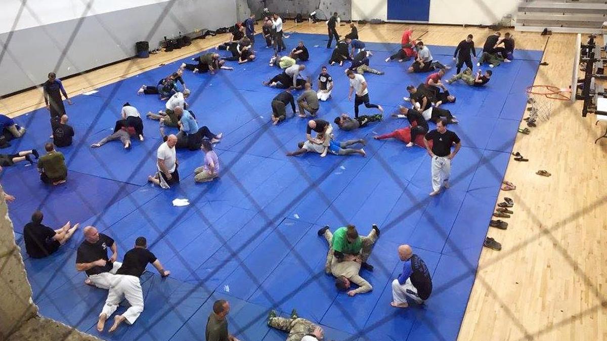 Law enforcement officers practice the Gracie Jiu-Jitsu skills they learned during a weeklong Gracie Survival Tactics course at the Garner Road Community Center in Raleigh.
