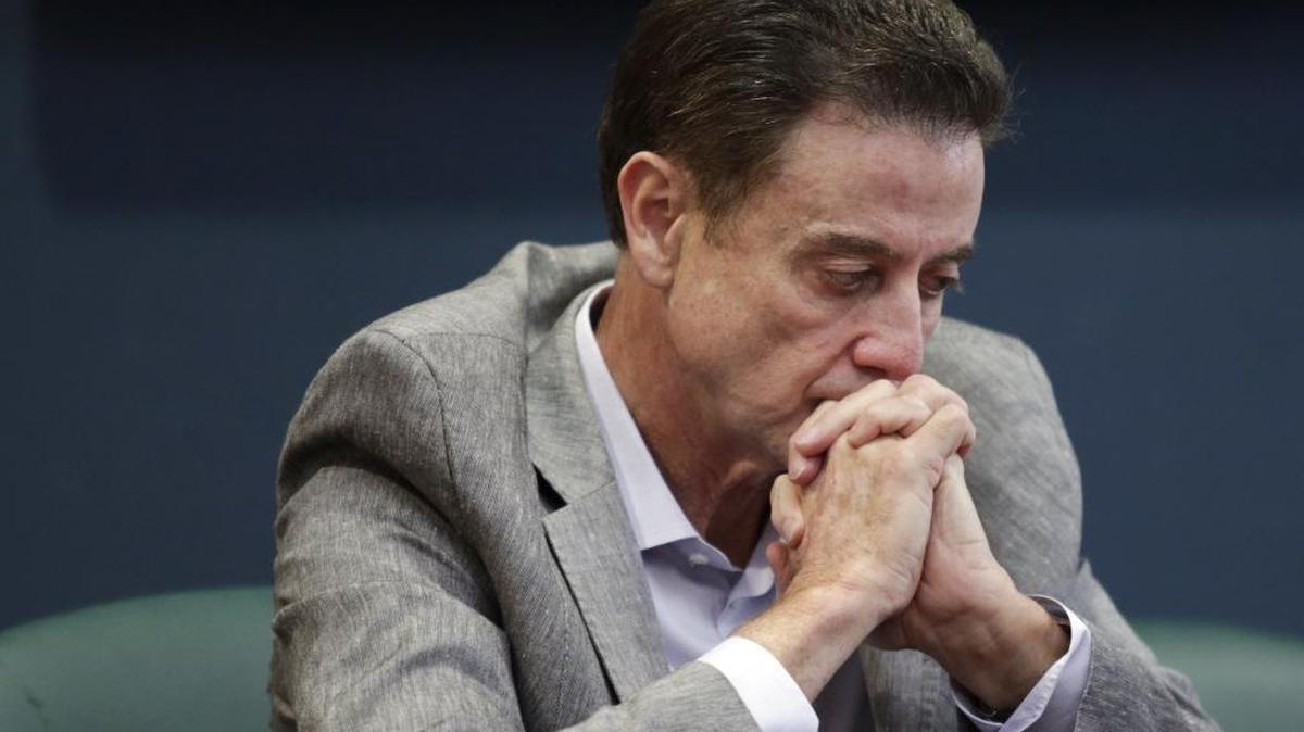 Louisville basketball coach Rick Pitino listens during an NCAA college basketball news conference Thursday, June 15, 2017 in Louisville, Ky. Pitino was placed on unpaid administrative leave by the University of Louisville on Wednesday, Sept. 27, 2017.