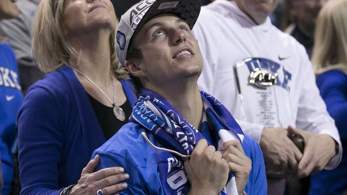 Duke’s Luke Kennard (5), the ACC Tournament MVP, is embraced by his parents Mark and Jennifer Kennard as they watch a video tribute following the Blue Devils’ 75-69 victory over Notre Dame in the championship game on Saturday, March 11, 2017 at the Barclays Center in Brooklyn, N.Y.