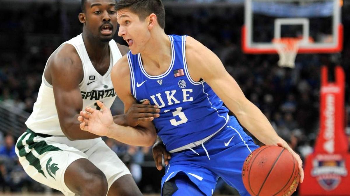 Duke guard Grayson Allen (3) drives on Michigan State guard Joshua Langford during the first half of an NCAA college basketball game Tuesday, Nov. 14, 2017, in Chicago.