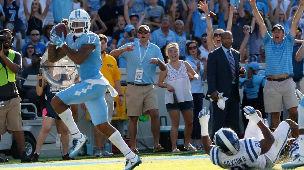 UNC’s Anthony Ratliff-Williams, left, hauls in a touchdown pass against Duke.