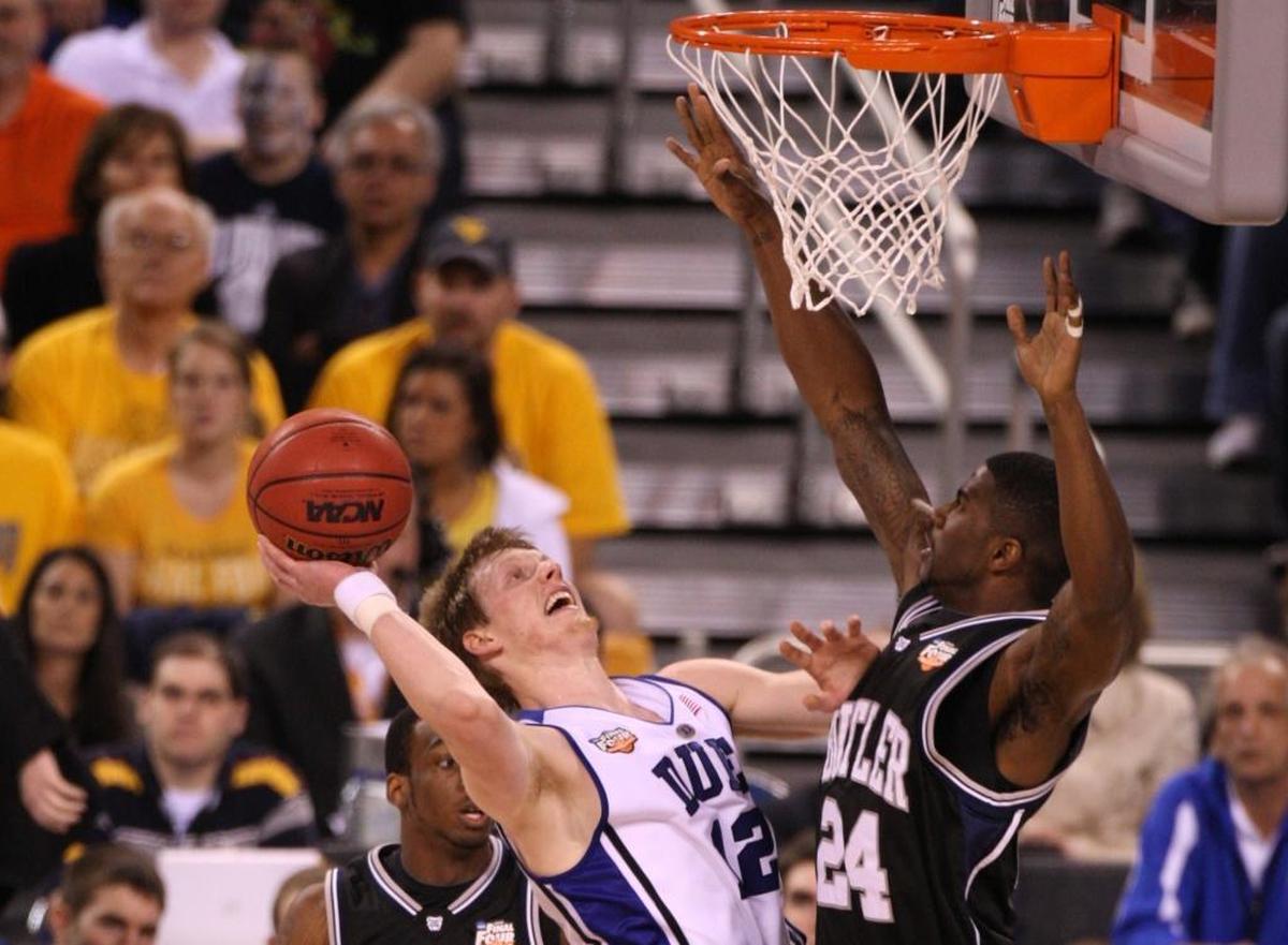 Duke’s Kyle Singler tries to take a shot over Butler’s Avery Jukes in the 2010 NCAA title game.