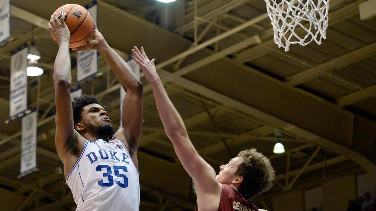 Duke forward Marvin Bagley III, left, goes in for a dunk against Elon forward Tyler Seibring on Nov. 10.