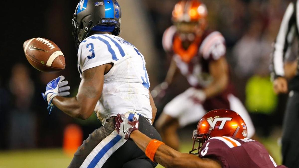 Duke wide receiver T.J. Rahming (3) loses the ball as Virginia Tech defensive back Mook Reynolds (6) knocks it loose during the first half of an NCAA college football game in Blacksburg, Va., Saturday, Oct. 28, 2017.