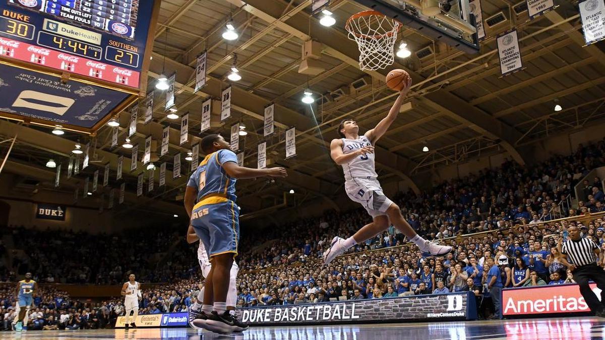 Duke guard Grayson Allen (3) goes in for two easy points over Southern University guard Brendon Ganaway (5) in the first half of play. Duke battled Southern University on Friday, Nov. 17, 2017, at Cameron Indoor Stadium in Durham.