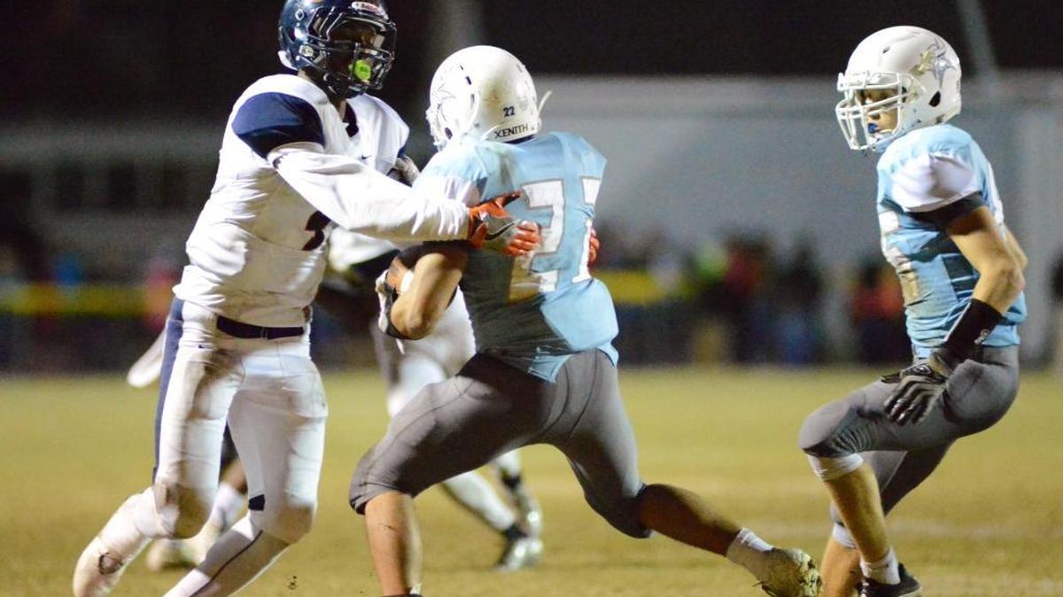 Southern Lee'e Nate Thompson (4) tackles Union Pines’ Julian Thomas (21) during a prep football game last Oct. 29 in Cameron. Thompson announced he’ll play college football at Duke.