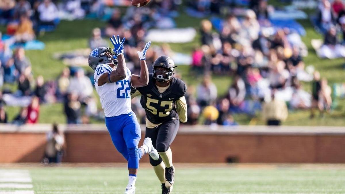 Duke running back Brittain Brown makes an over-the-shoulder catch as Wake Forest linebacker Duke Ejiofor pursues on Saturday at BB&T Field in Winston-Salem.