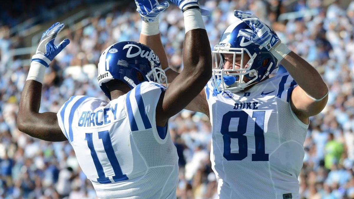 Duke’s Davis Koppenhaver, right, celebrates a touchdown with Scott Bracey, right during the Blue Devils’ win over UNC.