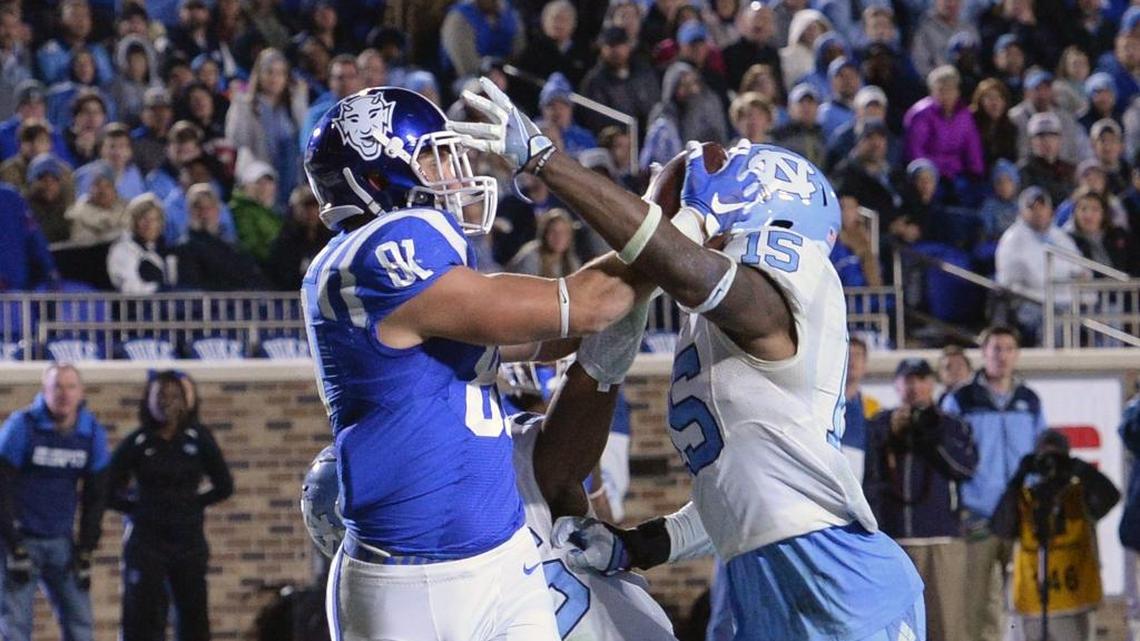 Duke tight end Davis Koppenhaver, left, makes the game winning touchdown over North Carolina safety Donnie Miles, right, as the Blue Devils beat the Tar Heels 28-27 on Nov. 10, 2016. The two teams play in September this year for the first time ever.