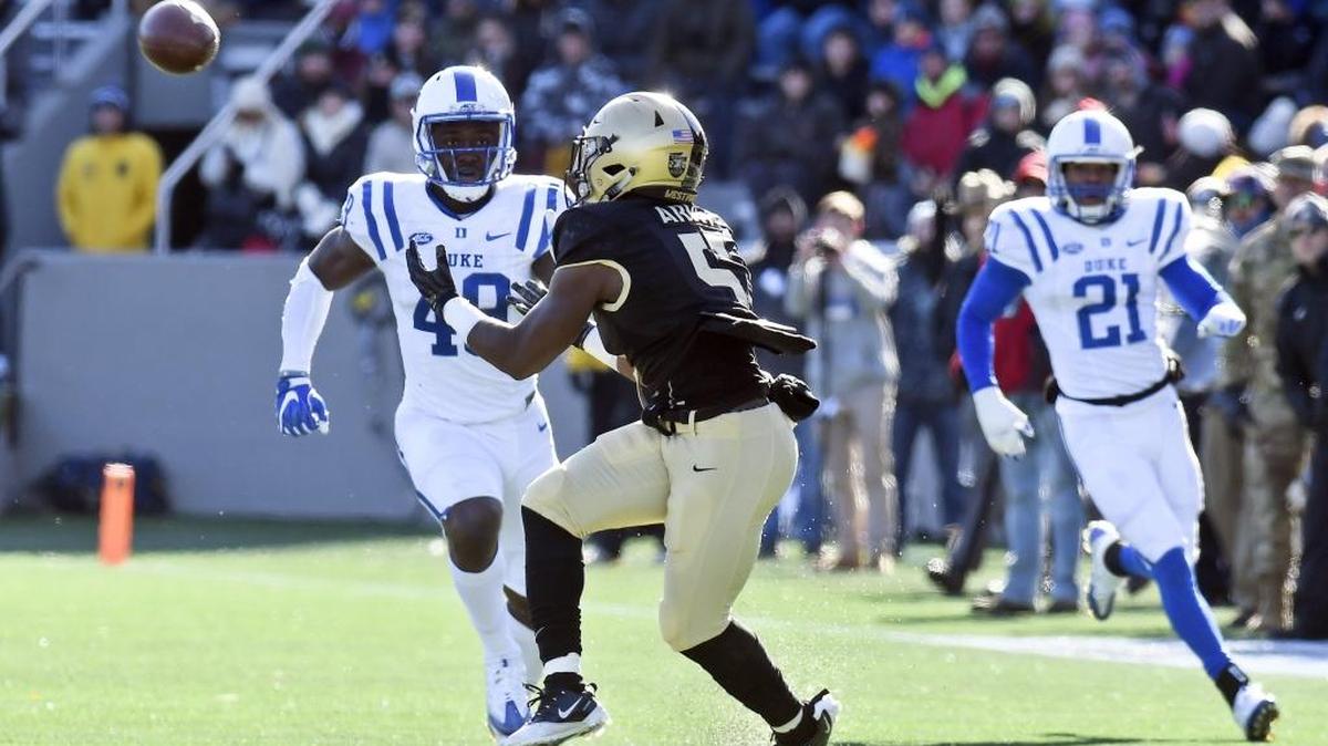 Army running back Kell Walker (5) makes a catch for 42 yards in front of Duke linebacker Koby Quansah (49) during the first half of an NCAA college football game on Saturday, Nov. 11, 2017, in West Point, N.Y. (AP Photo/Hans Pennink)
