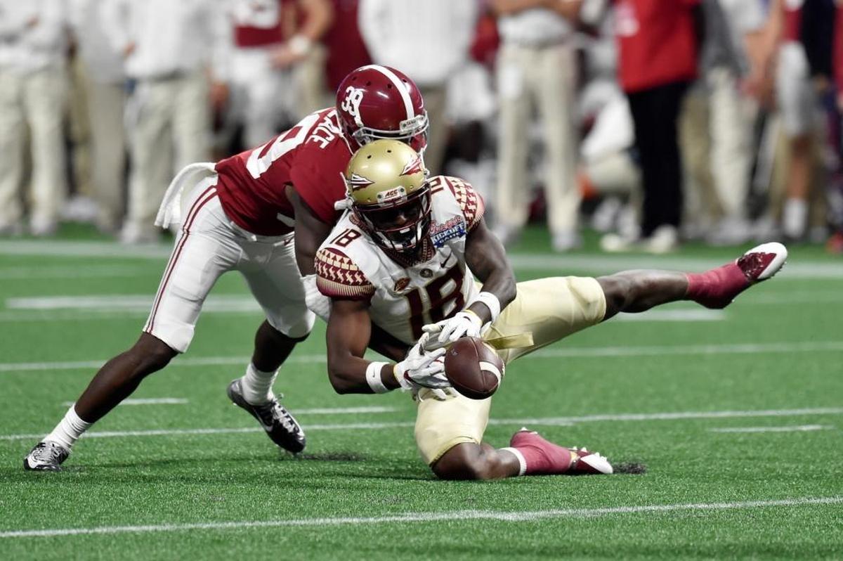 Alabama’s Levi Wallace, left, breaks up a pass intended for Florida State’s Auden Tate on Saturday.