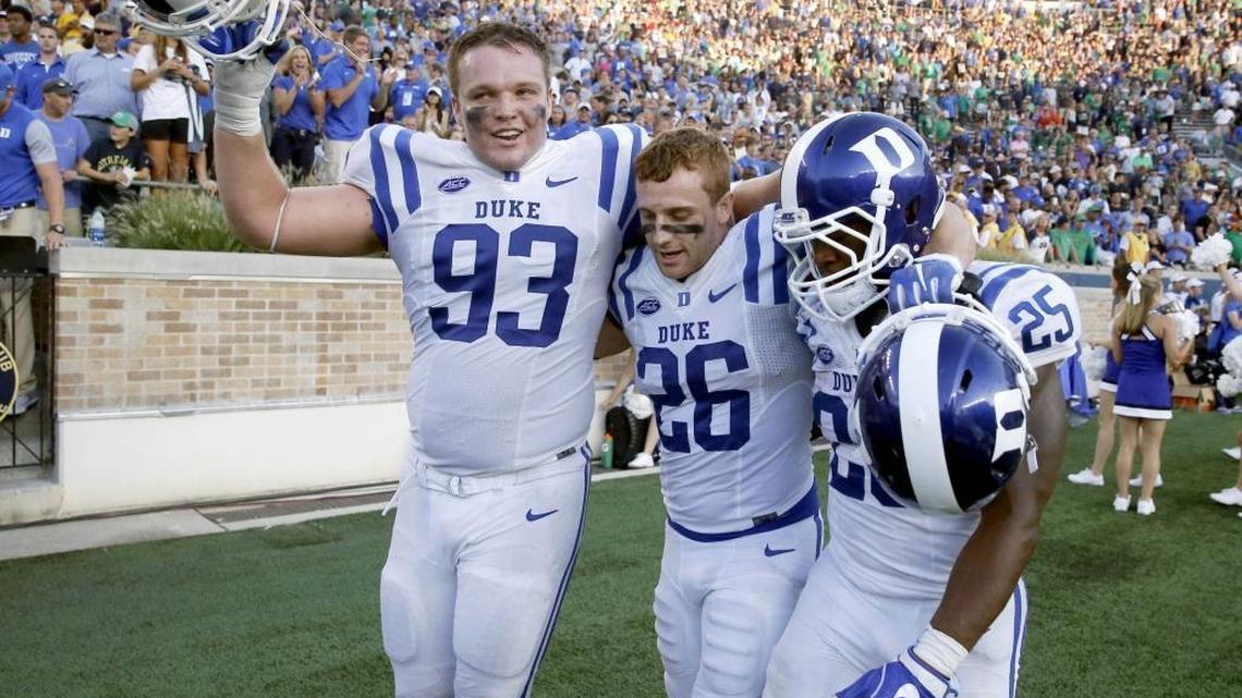 Duke’s A.J. Wolf, left, Corbin McCarthy, middle, and Jela Duncan celebrate the Blue Devils’ win over Notre Dame on Sept. 24.