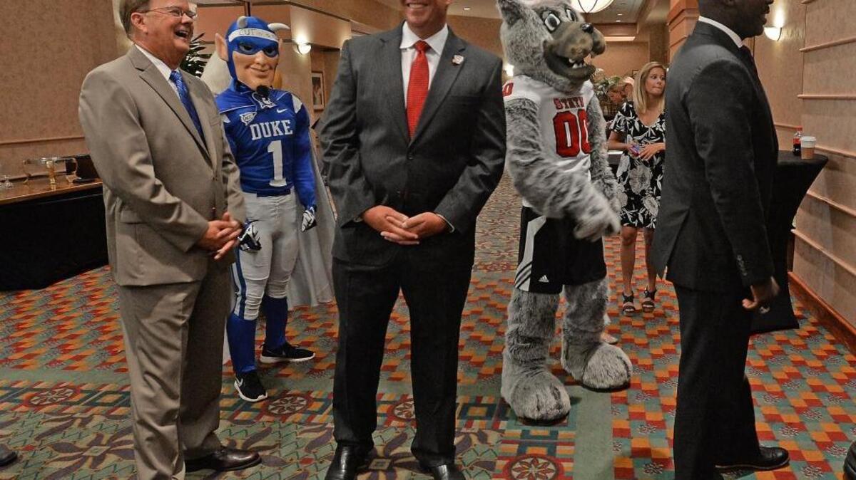 Coaches from the local Division 1 football programs spoke at the Bill Dooley Pigskin Preview in July. Waiting to be introduced are, left to right, Duke coach David Cutcliffe, N.C. State coach Dave Doeren and East Carolina coach Scottie Montgomery.