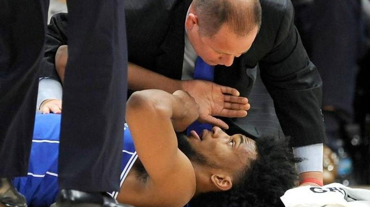 Duke assistant athletic trainer Jose Fonseca checks on forward Marvin Bagley III during the first half of the team’s NCAA college basketball game against Michigan State on Tuesday, Nov. 14, 2017, in Chicago.
