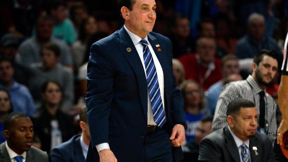 Duke coach Mike Krzyzewski laughs as he discusses a call with a game official against Troy in March.