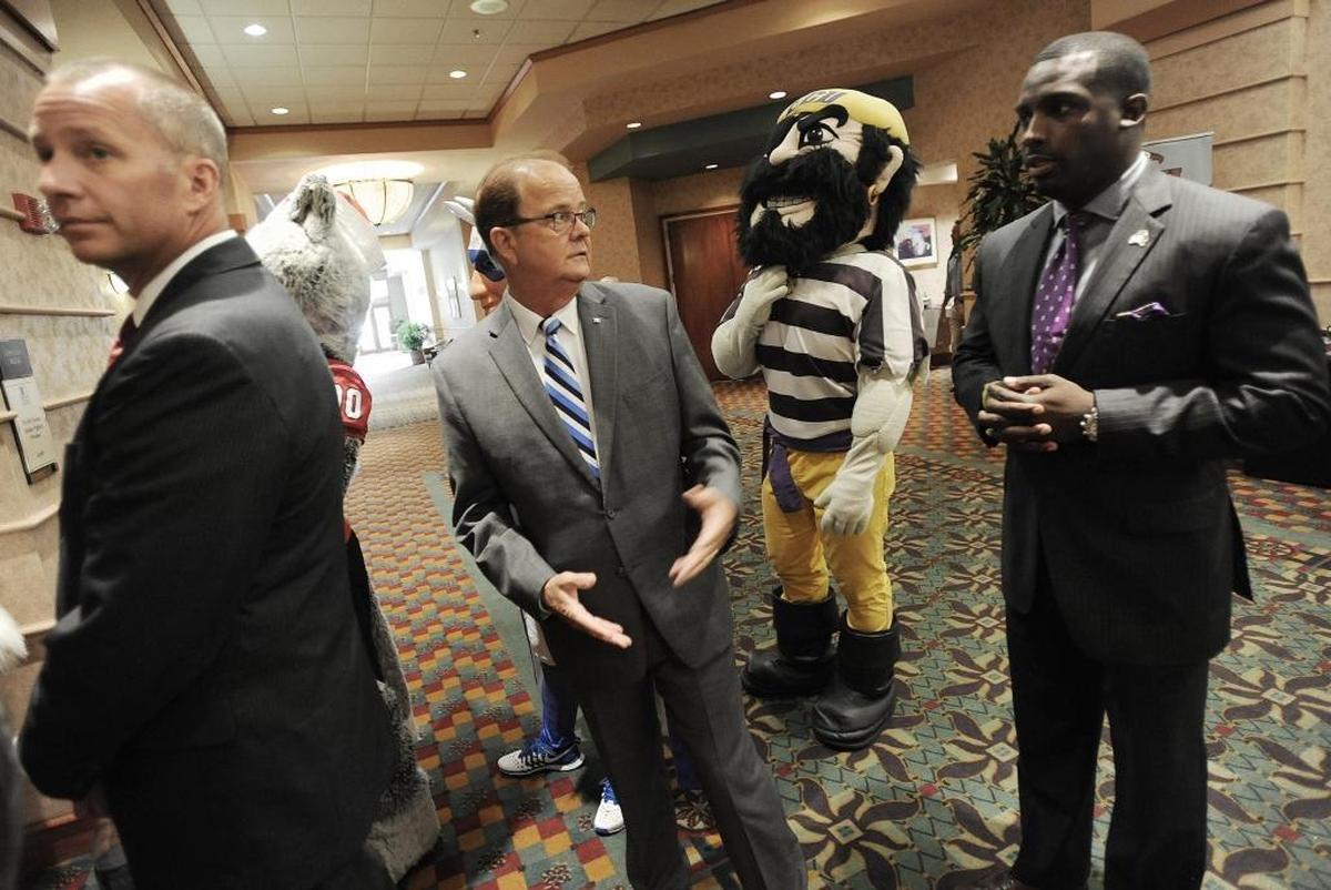N.C. State's Dave Doeren, Duke's David Cutcliffe and East Carolina's Scottie Montgomery are waiting for introduction during the Bill Dooley Pigskin Preview.