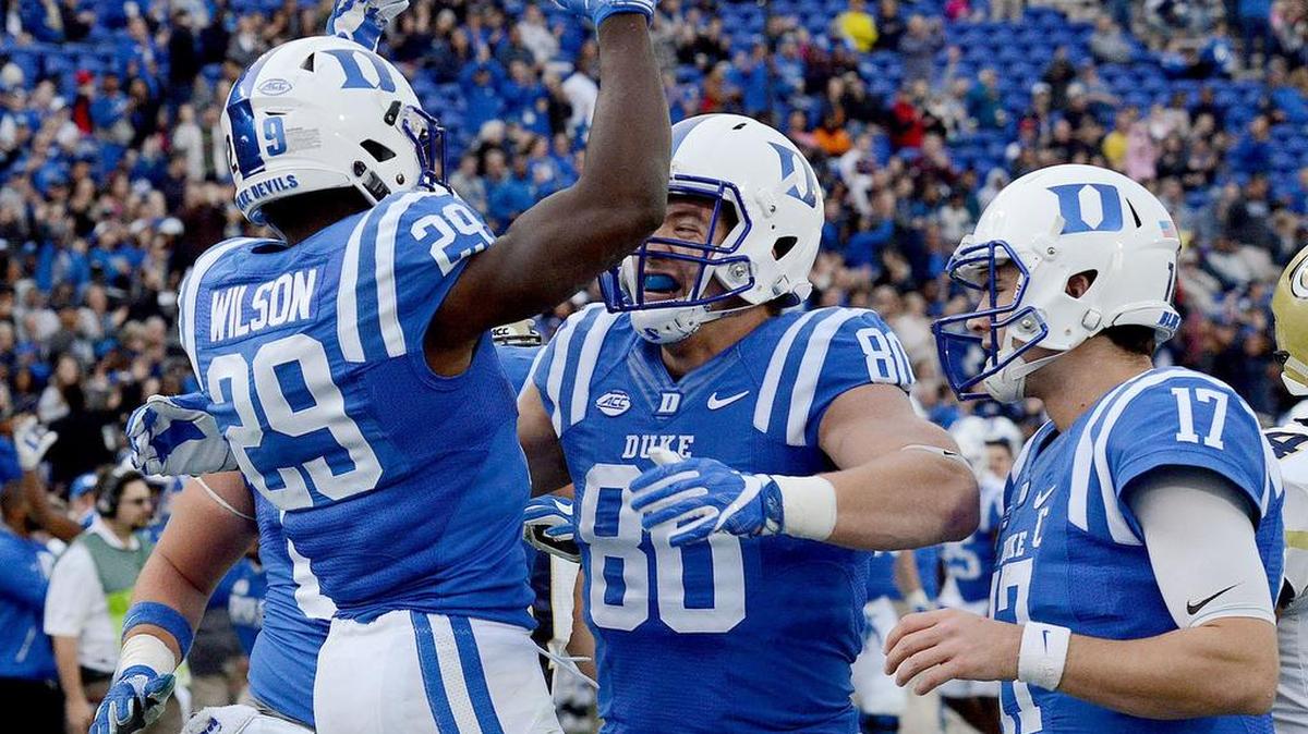 Duke’s Shaun Wilson (29) celebrates his touchdown with Daniel Helm (80) and Daniel Jones (17) against Georgia Tech, Saturday, November 18, 2017, in Durham.