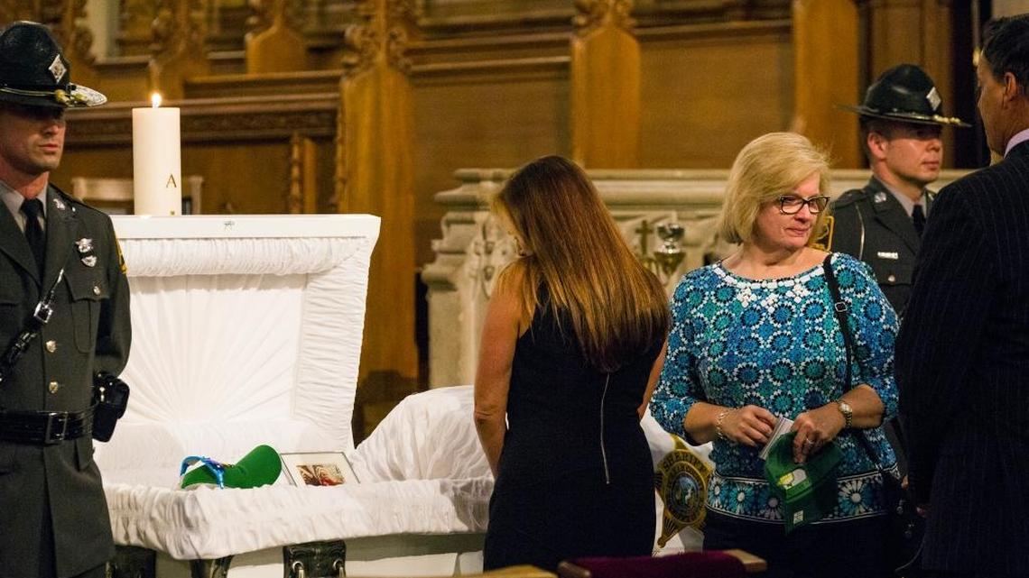 Catherine Gray finishes paying her respects to Howell Brown III, 13, during his funeral at Duke University Chapel on Wednesday, Aug. 30, 2017, in Durham, NC. Brown died Friday after a five-year battle with cancer. Gray is an office assistant with the N.C. State Highway Patrol who met Howell as he spent time with troopers during on and off-duty times.