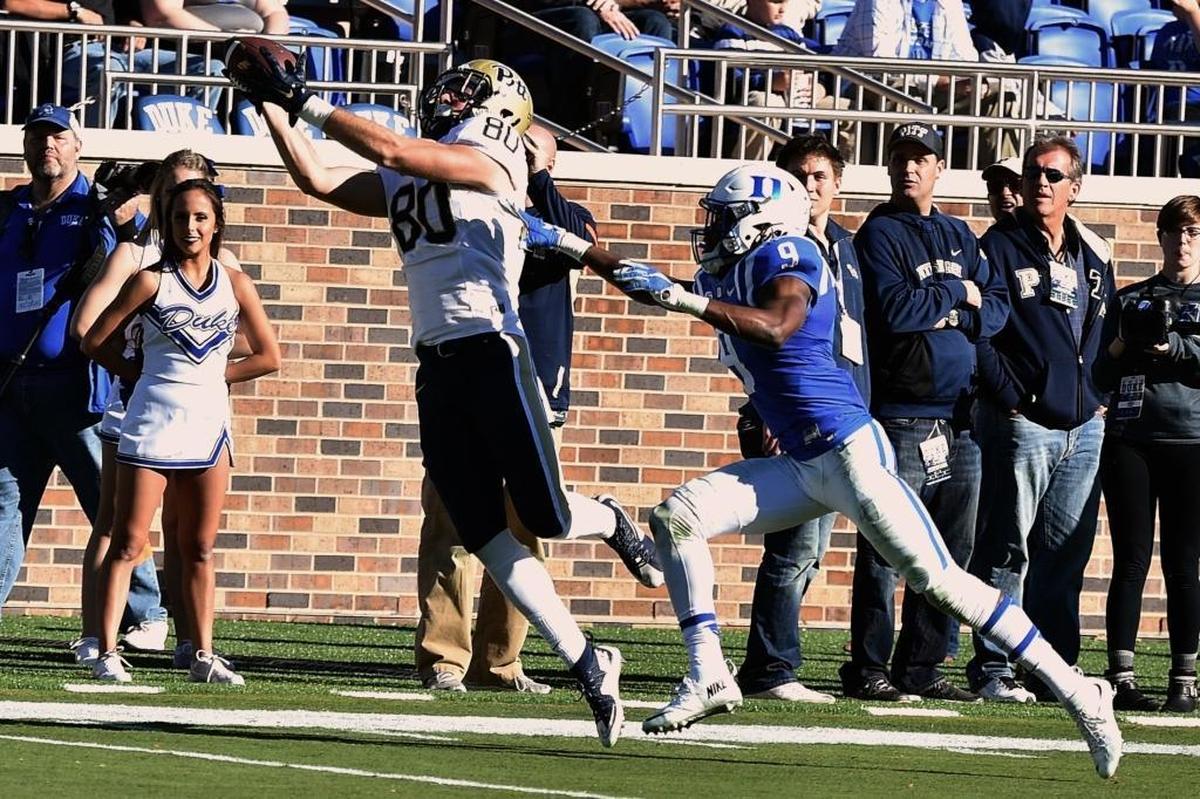 Zach Challingsworth (80) of the Pittsburgh Panthers catches a pass against Jeremy McDuffie (9) of the Duke Blue Devils at Wallace Wade Stadium on November 14, 2015 in Durham, North Carolina. Pittsburgh defeated Duke 31-13.