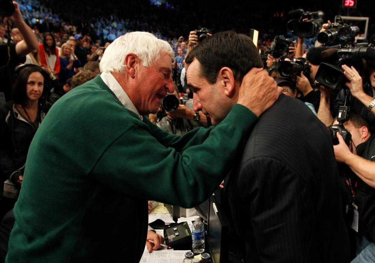 Mike Krzyzewski, right, speaks with mentor and former NCAA Division I record holder Bobby Knight after Krzyzewski wins his 903rd game.