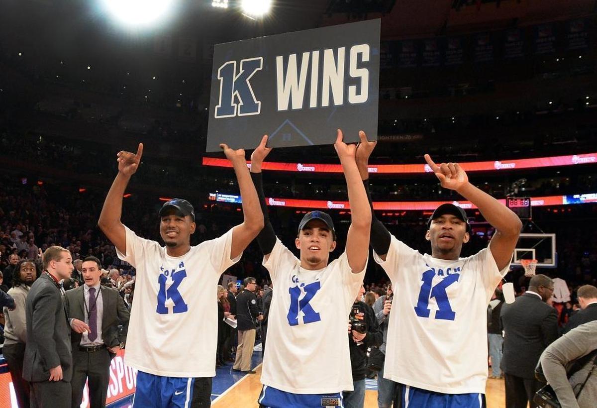Duke guard Matt Jones, left, guard Tyus Jones, middle, and guard Rasheed Sulaimon, right, parade around the court after Duke beat St. John’s 77-68 to give Coach K his 1,000th win.