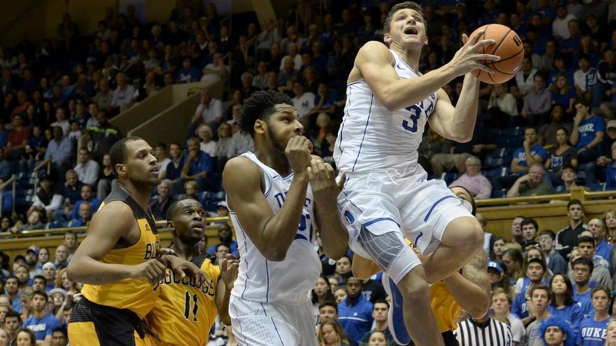 Duke guard Grayson Allen (3) goes in to score over Bowie State as teammate center Marques Bolden (20) tries to stay put of the way in the first half of play. Duke played Bowie State in an exhibition game at Cameron Indoor Stadium in Durham, N.C. Saturday, Nov. 4, 2017.