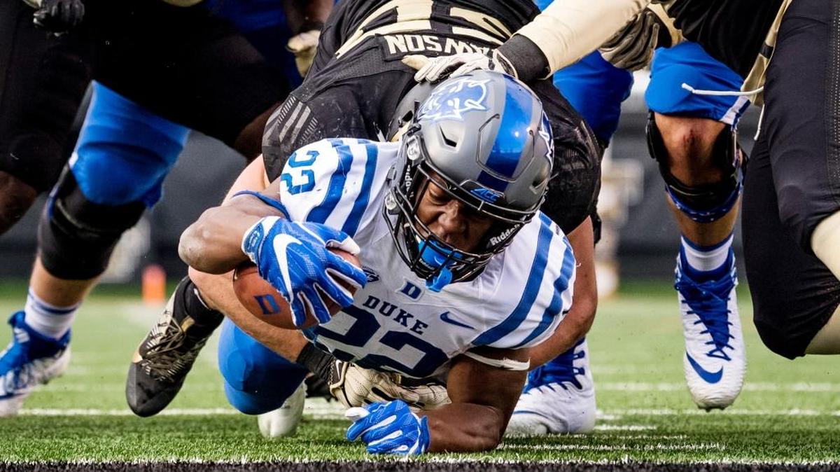 Duke's Brittain Brown stretches for extra yards in the Blue Devils' win over Wake Forest.