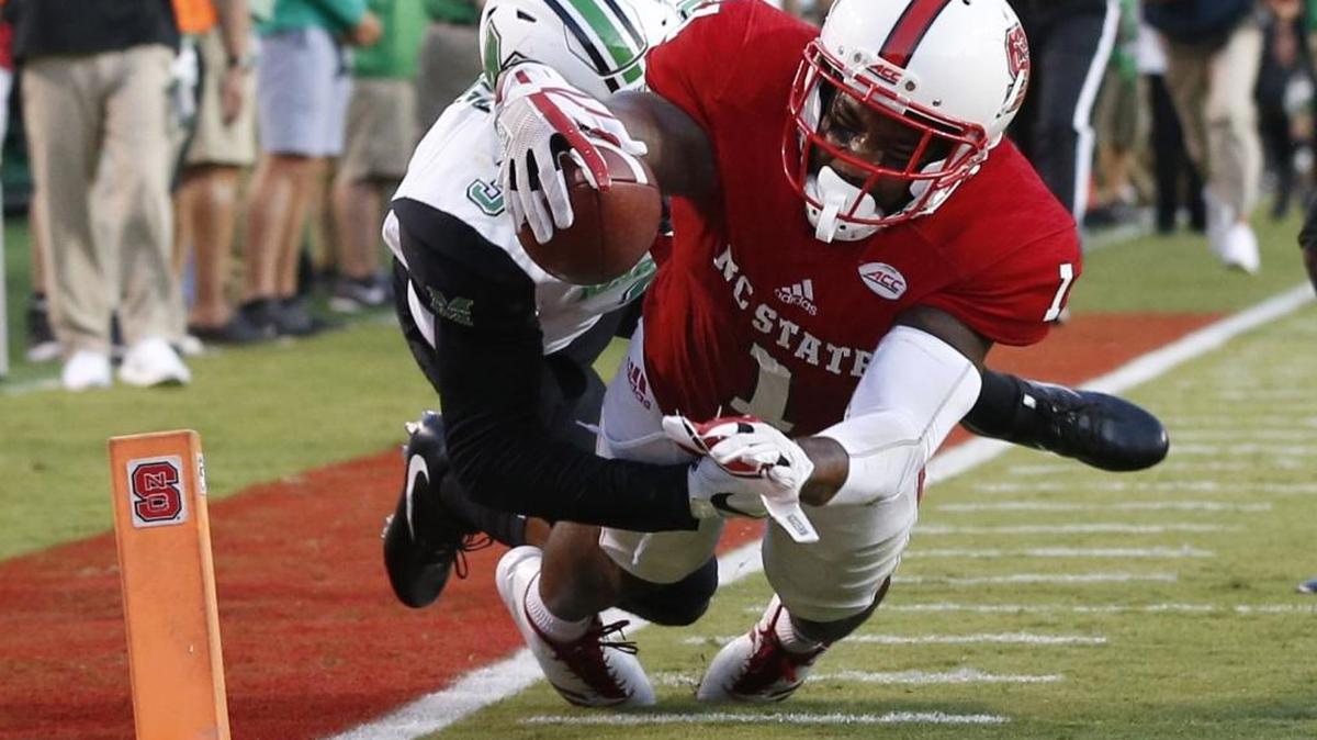 N.C. State’s Jaylen Samuels beats Marshall’s defensive back Chris Jackson to score on 39-yard touchdown reception during the Wolfpack’s win over the Thundering Herd on Saturday.