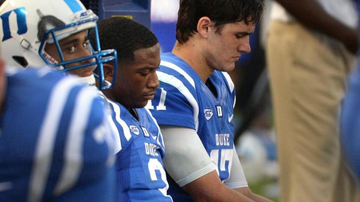 Duke wide receiver T.J. Rahming (3) and Duke quarterback Daniel Jones (17) sit in dejection in the closing seconds of their loss to Wake Forest in September.