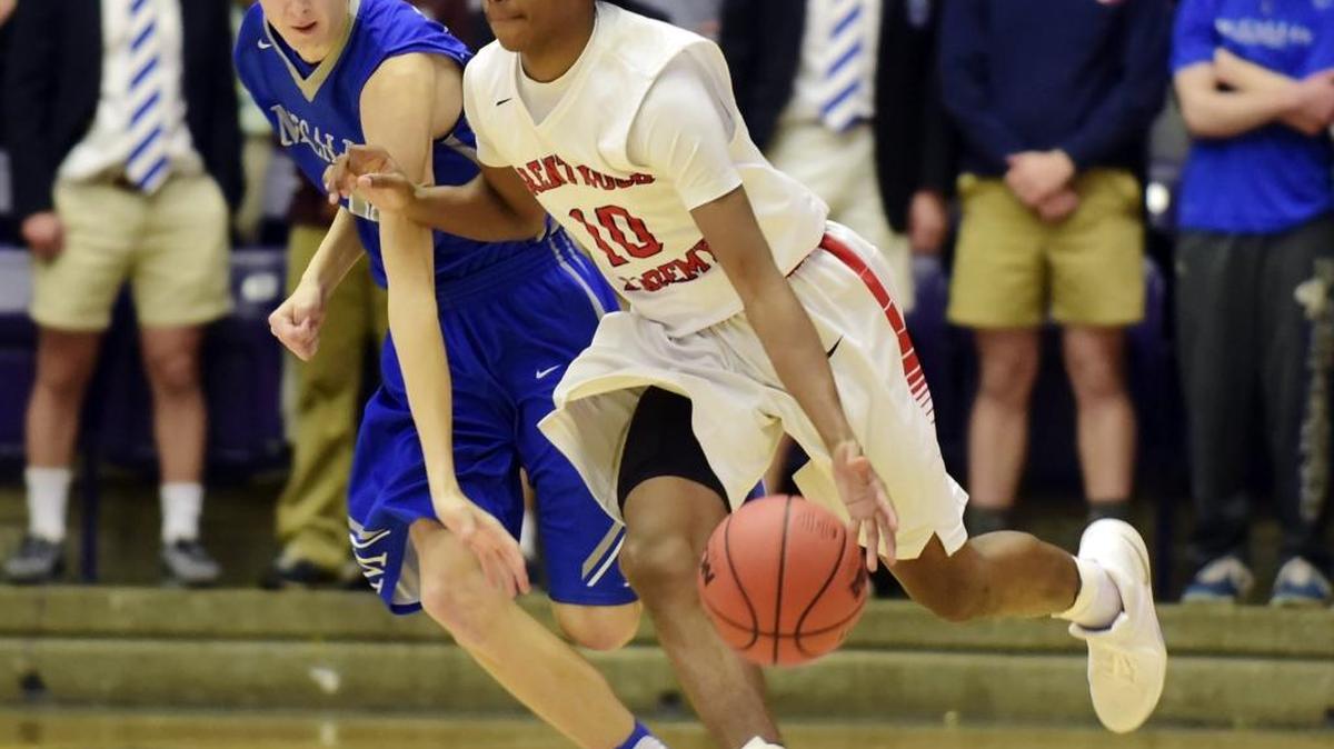 Brentwood Academy’s Darius Garland, right, drives past McCallie School’s Henley Edge, left, in March.