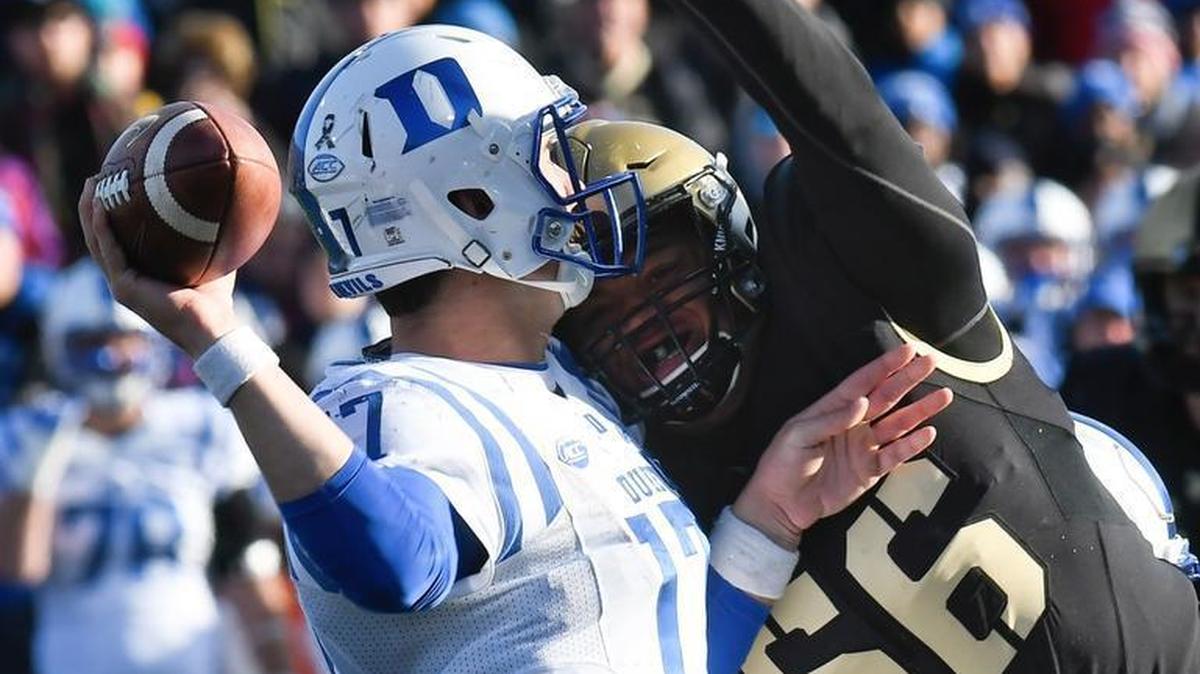 Duke quarterback Daniel Jones (17) is pressured by Army linebacker Kenneth Brinson (56) during Army’s 21-16 win on Saturday, Nov. 11, 2017, in West Point, N.Y. The loss was Duke’s sixth in a row