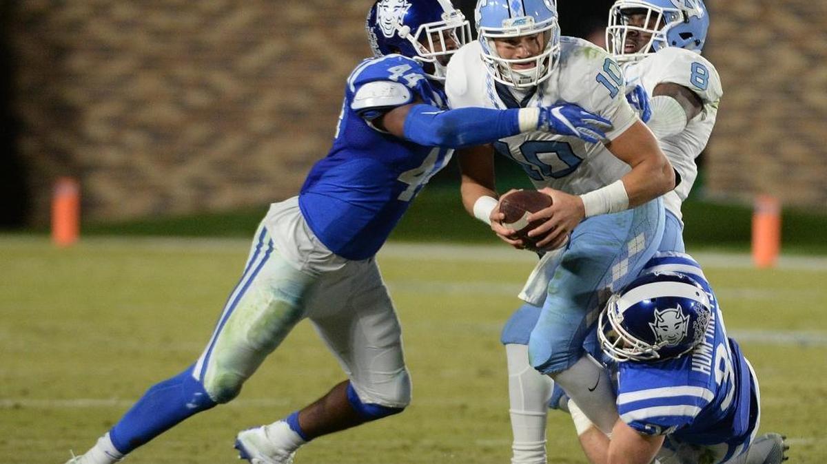 North Carolina quarterback Mitch Trubisky, middle, is sacked by Duke linebackers Joe Giles-Harris, left, and Ben Humphreys, bottom right, in 2016.