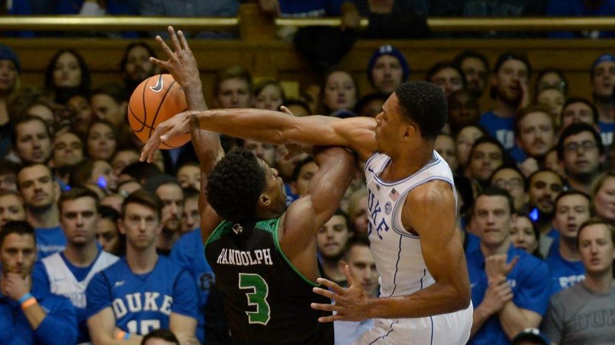 Duke guard Trevon Duval, right, swats away a shot by Utah Valley guard Brandon Randolph on Saturday.
