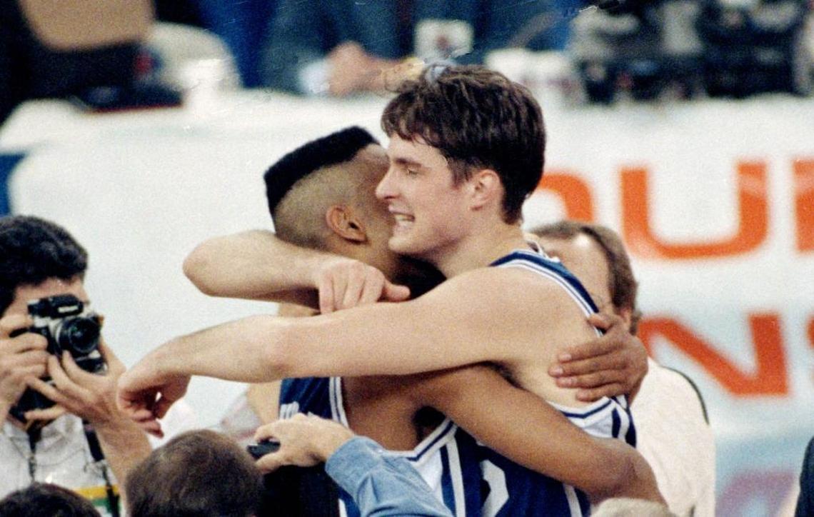 Duke’s Christian Laettner, right, hugs Grant Hill after the Blue Devils beat UNLV 79-77 in the Final Four semifinals on March 30, 1991.