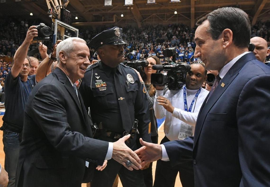 UNC head coach Roy Williams and Duke head coach Mike Krzyzewski greet each other prior to the start of their teams’ game. Both teams are in the massive PK80 - Phil Knight Invitational tournament field this November.