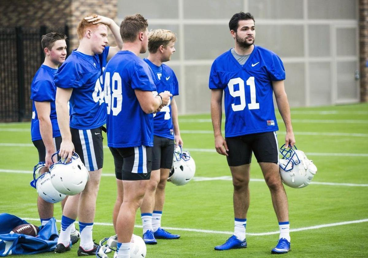 Willie Holmquist, right, walk-on kicker at Duke, practice on Aug. 2.