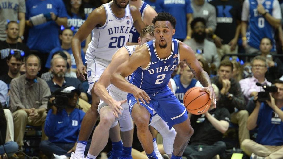 Duke freshman Gary Trent, Jr. (2) moves the ball around the White team's defense during the Blue Devils Blue-White game at Cameron Indoor Stadium in Durham on October 20, 2017.