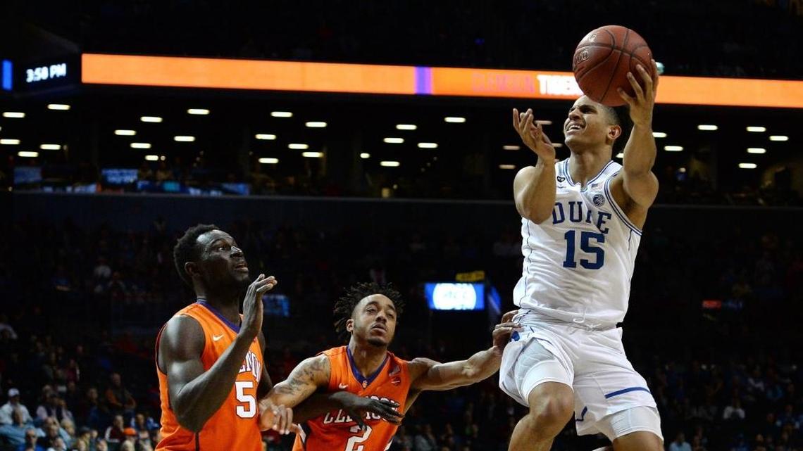 Duke guard Frank Jackson (15) goes up over Clemson center Sidy Djitte (50) and guard Marcquise Reed (2) in the second half of play during the ACC Men’s Basketball Tournament at the Barclays Center in Brooklyn on March 8, 2017.