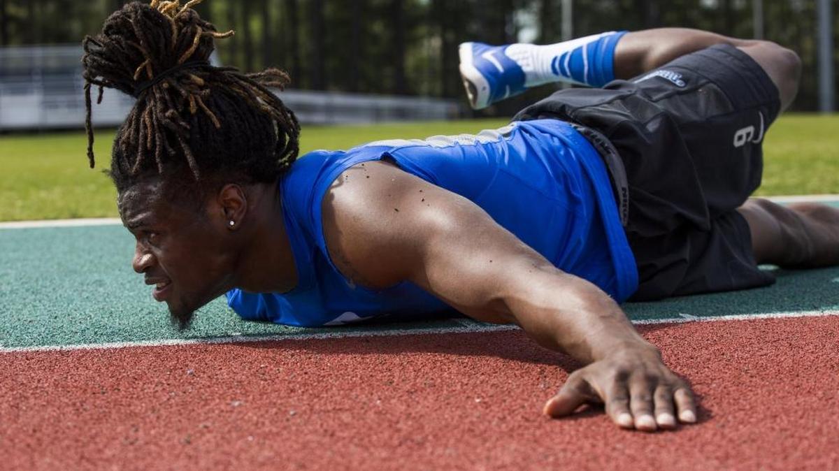 Jeremy McDuffie, a safety on the Duke football team, practices with the Duke track team in April.