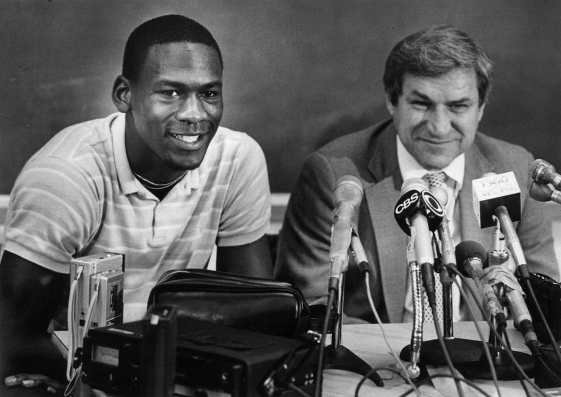 Michael Jordan (left) won an NCAA championship under coach Dean Smith at North Carolina before leaving the Tar Heels a year early in 1984 to turn pro.