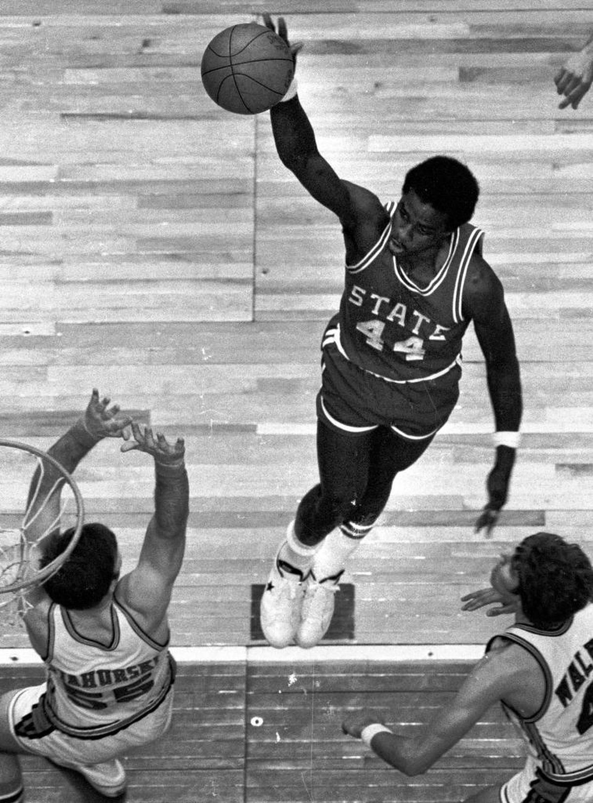 N.C. State’s David Thompson soars to the basket against Virginia in the 1974 ACC tournament. As Denver Nuggets general manager, Carl Scheer was able to lure Thompson to the ABA rather than the rival NBA.